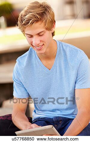 Male High School Student Using Digital Tablet Outdoors View Large Photo Image Stock Image - Male High School Student Using Digital Tablet Outdoors. Fotosearch