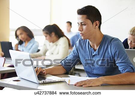 Male High School Student Using Laptop In Class View Large Photo Image Picture - Male High School Student Using Laptop In Class. Fotosearch
