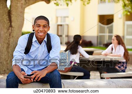 Male High School Student Using Phone On School Campus View Large Photo Image Stock Image - Male High School Student Using Phone On School Campus . Fotosearch