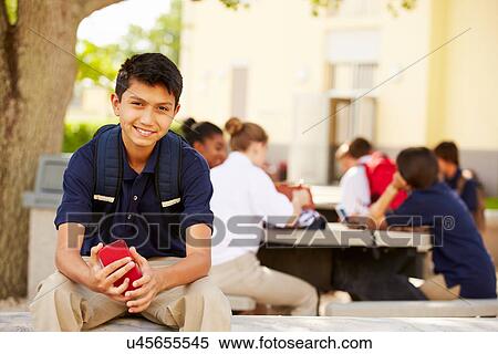 Male High School Student Using Phone On School Campus View Large Photo Image Stock Photography - Male High School Student Using Phone On School Campus . Fotosearch