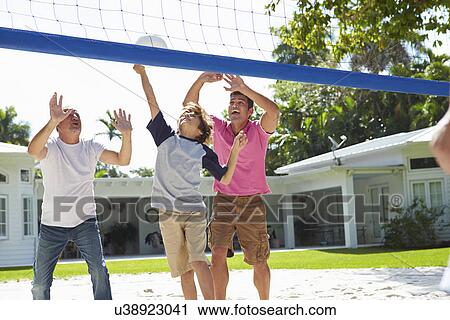 Male Multi Generation Family Playing Volleyball In Garden View Large Photo Image Stock Image - Male Multi Generation Family Playing Volleyball In Garden. Fotosearch