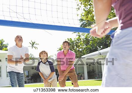 Male Multi Generation Family Playing Volleyball In Garden View Large Photo Image Stock Photo - Male Multi Generation Family Playing Volleyball In Garden. Fotosearch