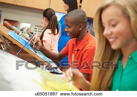 Stock Photo - Male Pupil In High School Art Class. Fotosearch