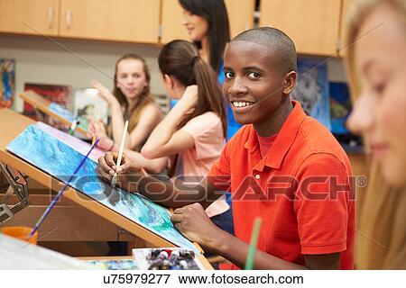 Stock Photo - Male Pupil In High School Art Class. Fotosearch
