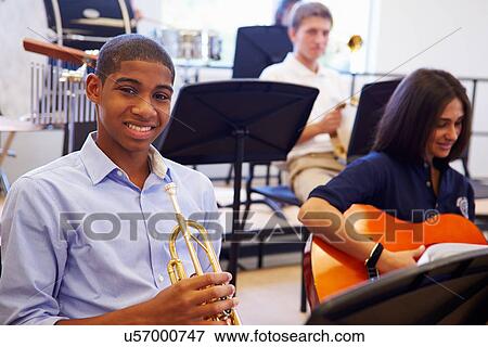 Male Pupil Playing Trumpet In High School Orchestra View Large Photo Image Stock Photo - Male Pupil Playing Trumpet In High School Orchestra. Fotosearch