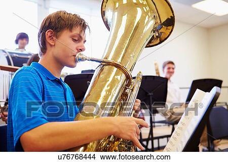 Male Pupil Playing Tuba In High School Orchestra View Large Photo Image Picture - Male Pupil Playing Tuba In High School Orchestra. Fotosearch