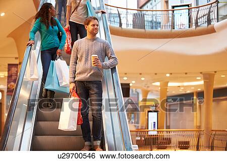 Male Shopper On Escalator In Shopping Mall View Large Photo Image Stock Photograph - Male Shopper On Escalator In Shopping Mall . Fotosearch