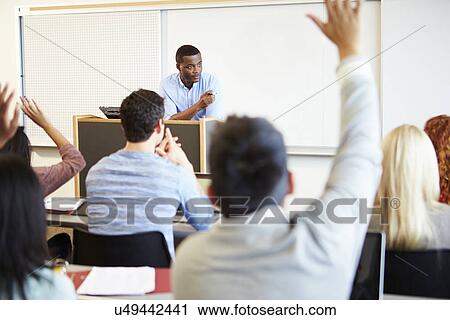 Male Tutor Teaching University Students In Classroom View Large Photo Image Stock Image - Male Tutor Teaching University Students In Classroom. Fotosearch