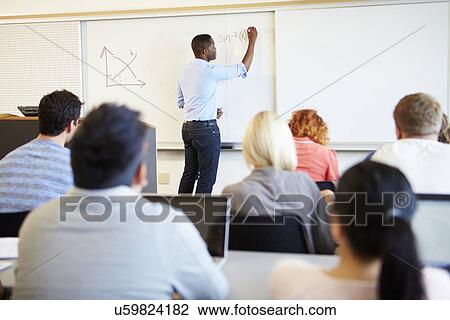 Male Tutor Teaching University Students In Classroom View Large Photo Image Stock Image - Male Tutor Teaching University Students In Classroom. Fotosearch
