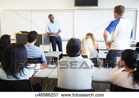 Male Tutor Teaching University Students In Classroom View Large Photo Image Stock Photo - Male Tutor Teaching University Students In Classroom. Fotosearch