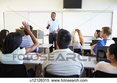 Male Tutor Teaching University Students In Classroom View Large Photo Image Stock Photography - Male Tutor Teaching University Students In Classroom. Fotosearch