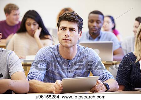 Male University Student Using Digital Tablet In Lecture View Large Photo Image Picture - Male University Student Using Digital Tablet In Lecture. Fotosearch
