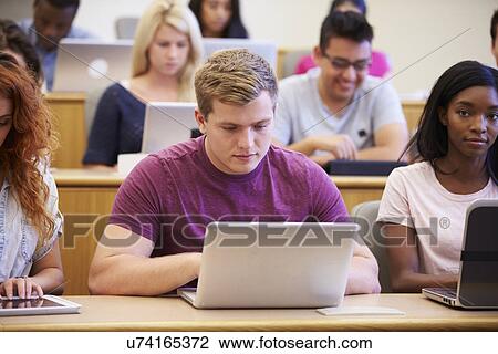 Male University Student Using Laptop In Lecture View Large Photo Image Stock Image - Male University Student Using Laptop In Lecture. Fotosearch