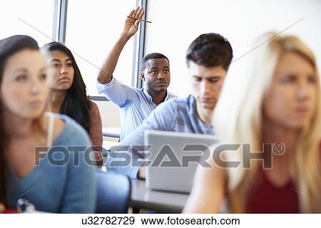 Male University Student Using Laptop In Classroom View Large Photo Image Stock Photo - Male University Student Using Laptop In Classroom. Fotosearch