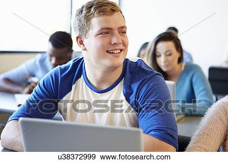 Male University Student Using Laptop In Classroom View Large Photo Image Stock Photo - Male University Student Using Laptop In Classroom. Fotosearch
