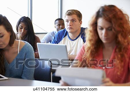 Male University Student Using Laptop In Classroom View Large Photo Image Stock Photography - Male University Student Using Laptop In Classroom. Fotosearch