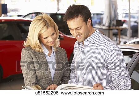 Stock Photograph - Man buying new car. Fotosearch