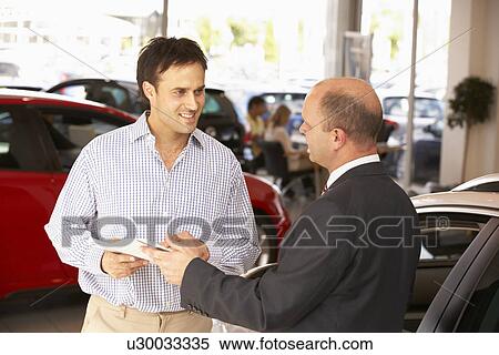 Stock Photography - Man buying new car. Fotosearch