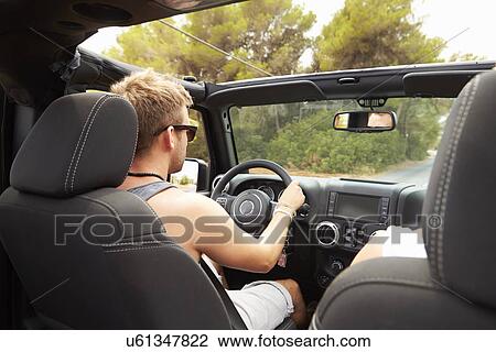 Man Driving Open Top Car Along Country Road View Large Photo Image Stock Image - Man Driving Open Top Car Along Country Road. Fotosearch