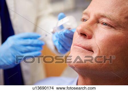 Man Having Botox Treatment At Beauty Clinic View Large Photo Image Picture - Man Having Botox Treatment At Beauty Clinic. Fotosearch