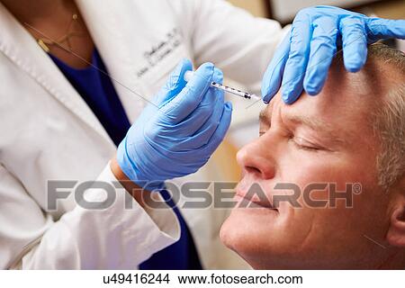 Picture - Man Having Botox Treatment At Beauty Clinic. Fotosearch