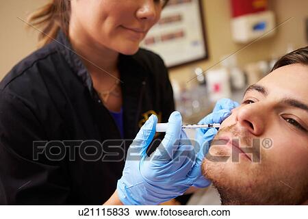 Man Having Botox Treatment At Beauty Clinic View Large Photo Image Stock Image - Man Having Botox Treatment At Beauty Clinic. Fotosearch