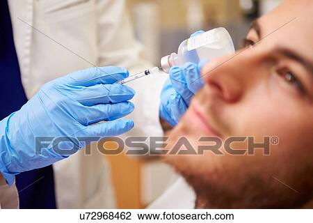 Man Having Botox Treatment At Beauty Clinic View Large Photo Image Stock Image - Man Having Botox Treatment At Beauty Clinic. Fotosearch