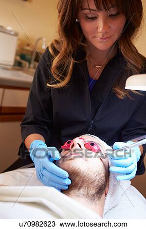 Man Having Dermo Abrasion Cosmetic Treatment At Spa View Large Photo Image Stock Image - Man Having Dermo Abrasion Cosmetic Treatment At Spa. Fotosearch