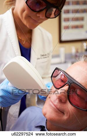 Man Having Laser Treatment At Beauty Clinic View Large Photo Image Picture - Man Having Laser Treatment At Beauty Clinic. Fotosearch
