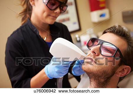 Man Having Laser Treatment At Beauty Clinic View Large Photo Image Stock Image - Man Having Laser Treatment At Beauty Clinic. Fotosearch
