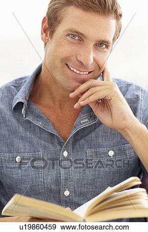 Man reading book View Large Photo Image Stock Photo - Man reading book. Fotosearch