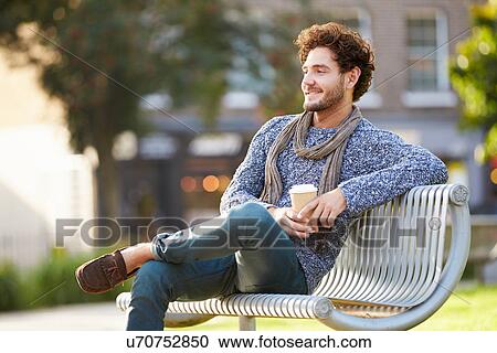 Man Relaxing On Park Bench With Takeaway Coffee View Large Photo Image Stock Image - Man Relaxing On Park Bench With Takeaway Coffee. Fotosearch