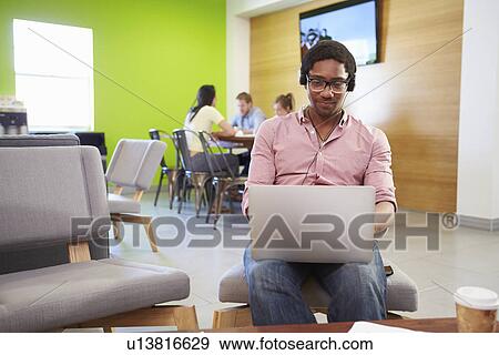 Stock Photo - Man Taking A Break Working In Design Studio . Fotosearch