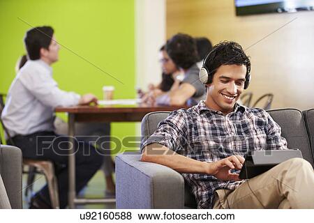 Man Taking A Break Working In Design Studio View Large Photo Image Stock Photo - Man Taking A Break Working In Design Studio . Fotosearch