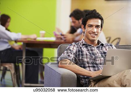 Stock Photo - Man Taking A Break Working In Design Studio . Fotosearch