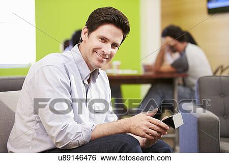 Man Taking A Break Working In Design Studio View Large Photo Image Stock Photograph - Man Taking A Break Working In Design Studio . Fotosearch