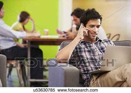 Stock Photography - Man Taking A Break Working In Design Studio . Fotosearch