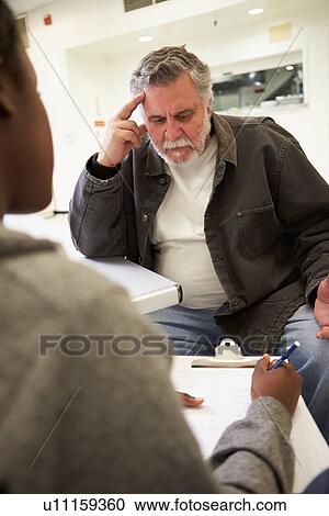 Man Talking To Counsellor Who Takes Notes View Large Photo Image Stock Image - Man Talking To Counsellor Who Takes Notes. Fotosearch