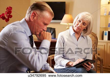 Man Talking To Female Counsellor Using Digital Tablet View Large Photo Image Stock Photography - Man Talking To Female Counsellor Using Digital Tablet. Fotosearch