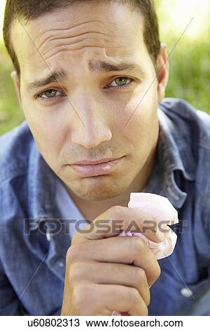 Stock Image - Man with hay fever. Fotosearch