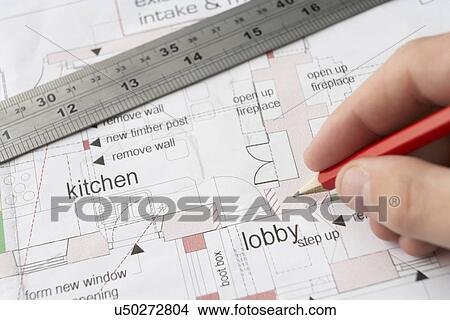 Picture - Man working on technical drawing. Fotosearch