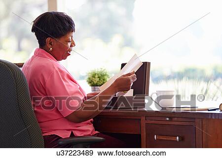 Mature Woman Putting Letter Into Keepsake Box View Large Photo Image Stock Photo - Mature Woman Putting Letter Into Keepsake Box. Fotosearch