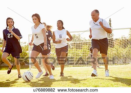 Members Of Female High School Soccer Playing Match View Large Photo Image Stock Image - Members Of Female High School Soccer Playing Match. Fotosearch