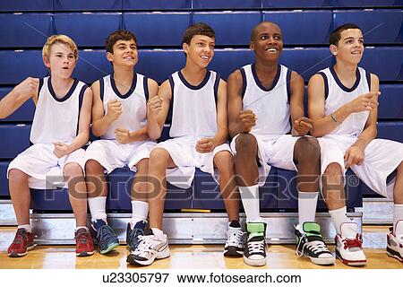 Stock Photo - Members Of Male High School Basketball Team Watching Match. Fotosearch