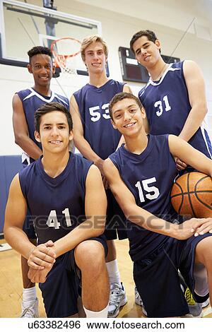 Stock Photograph - Members Of Male High School Basketball Team. Fotosearch