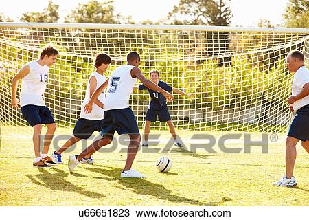 Members Of Male High School Soccer Playing Match View Large Photo Image Stock Image - Members Of Male High School Soccer Playing Match. Fotosearch