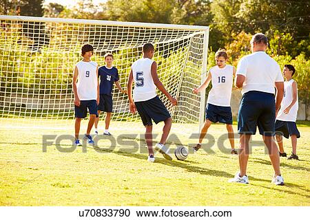 Members Of Male High School Soccer Playing Match View Large Photo Image Stock Image - Members Of Male High School Soccer Playing Match. Fotosearch