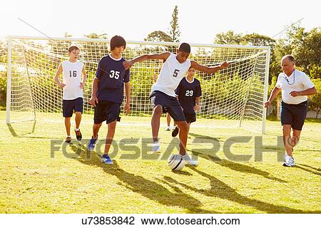 Members Of Male High School Soccer Playing Match View Large Photo Image Stock Image - Members Of Male High School Soccer Playing Match. Fotosearch
