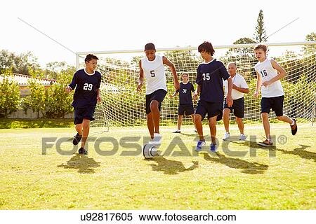 Members Of Male High School Soccer Playing Match View Large Photo Image Stock Photography - Members Of Male High School Soccer Playing Match. Fotosearch