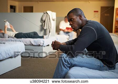 Men Sitting On Beds In Homeless Shelter View Large Photo Image Stock Image - Men Sitting On Beds In Homeless Shelter. Fotosearch